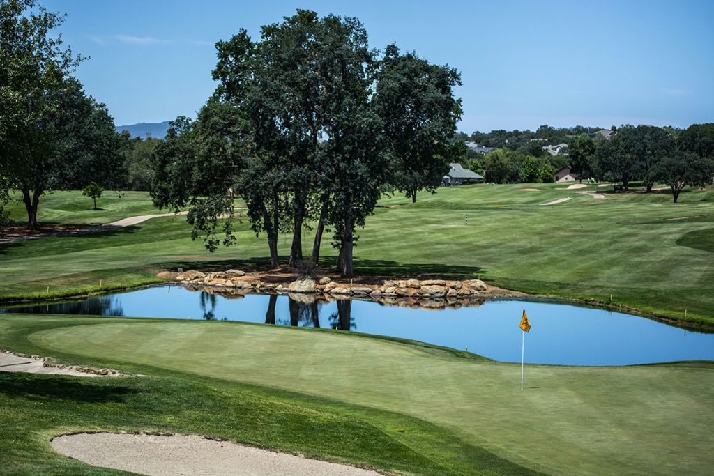 Panoramic view of a lush green golf course at Greystone Golf and Country Club. Smooth