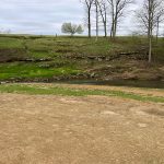 Panoramic view of a lush green golf course at Whippoorwill Golf Course. Smooth