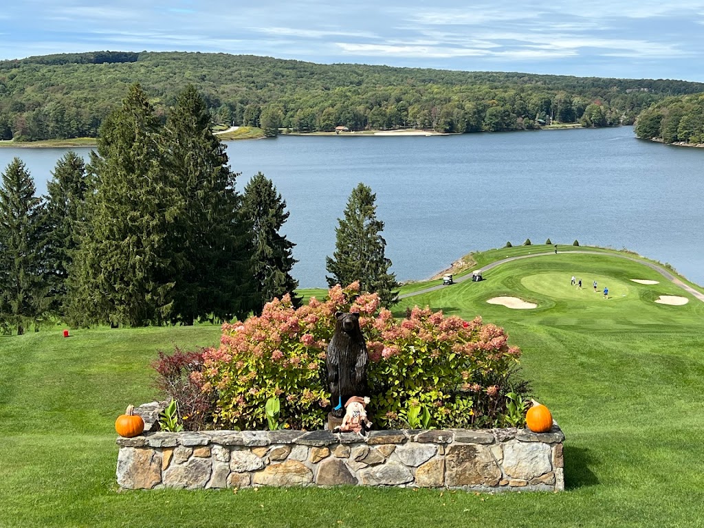 Panoramic view of a lush green golf course at Alpine Lake. Smooth