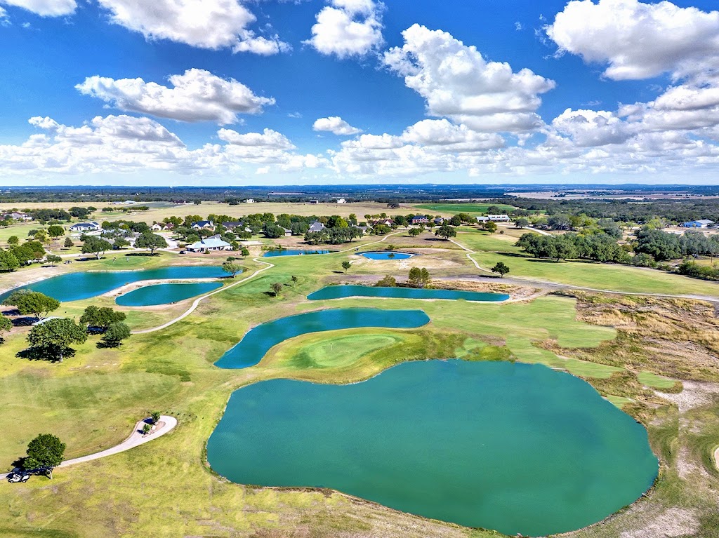 Panoramic view of a lush green golf course at Alsatian Golf Club. Smooth