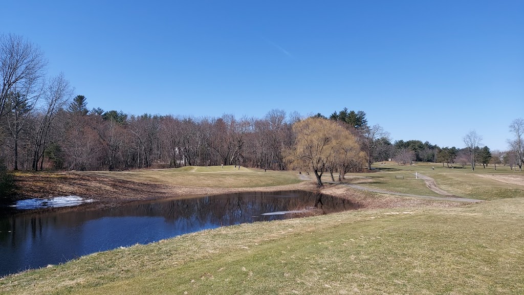 Panoramic view of a lush green golf course at Amherst Country Club. Smooth