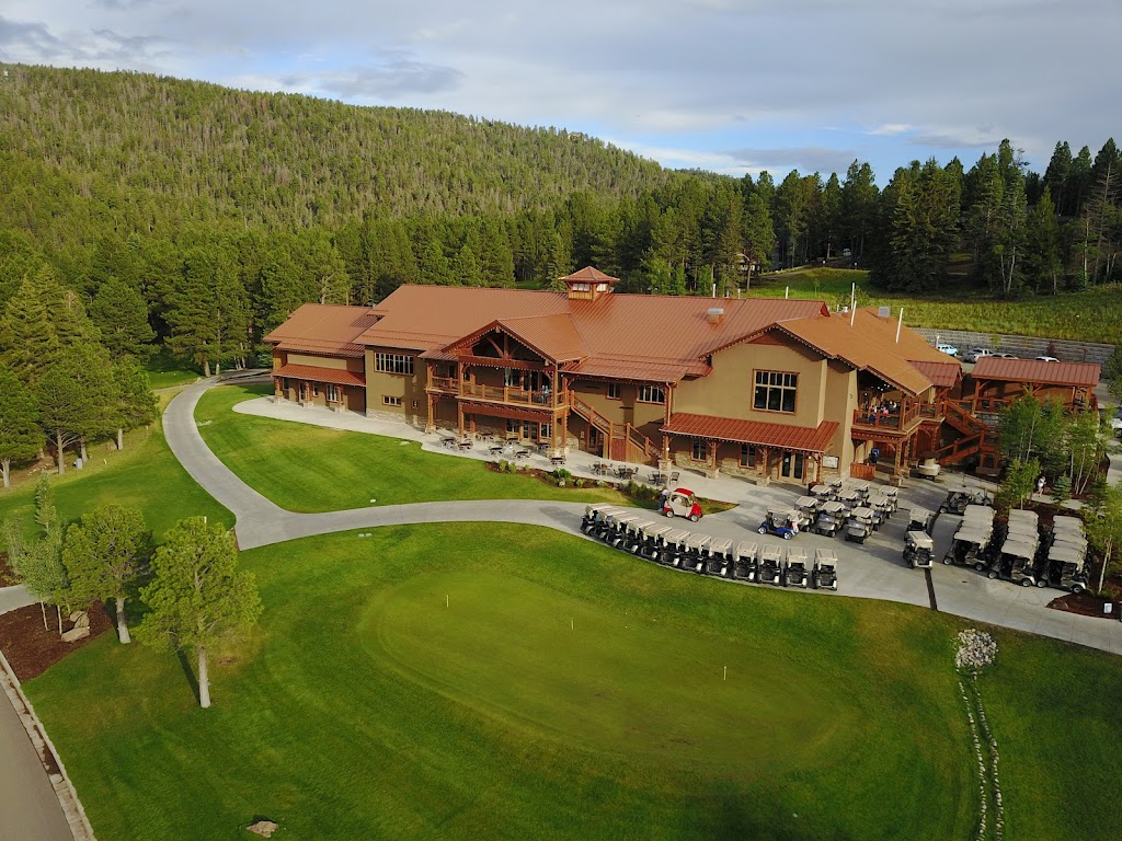 Panoramic view of a lush green golf course at Angel Fire Country Club. Smooth