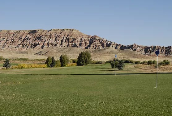 Panoramic view of a lush green golf course at Antelope Hills Golf Course. Smooth