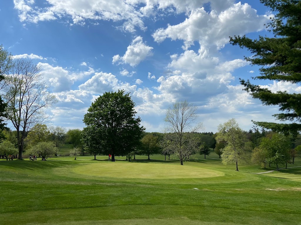 Panoramic view of a lush green golf course at Apple Hill Golf Course. Smooth