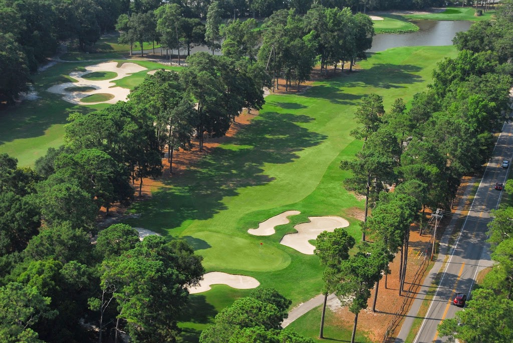 Panoramic view of a lush green golf course at Arcadian Shores Golf Club. Smooth