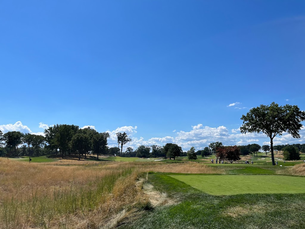 Panoramic view of a lush green golf course at Arcola Country Club. Smooth