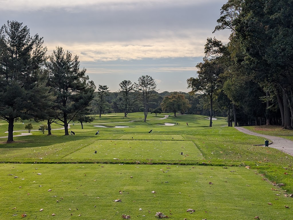 Panoramic view of a lush green golf course at Army Navy Country Club. Smooth