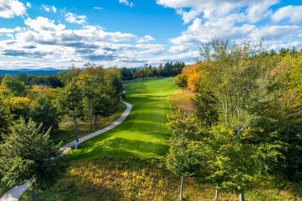 Panoramic view of a lush green golf course at Baker Hill Golf Club. Smooth