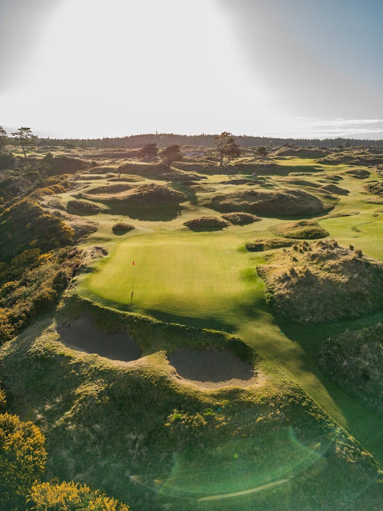 Panoramic view of a lush green golf course at Bandon Dunes Golf Resort - Bandon Preserve. Smooth