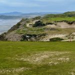 Panoramic view of a lush green golf course at Bandon Dunes Golf Resort - Pacific Dunes. Smooth