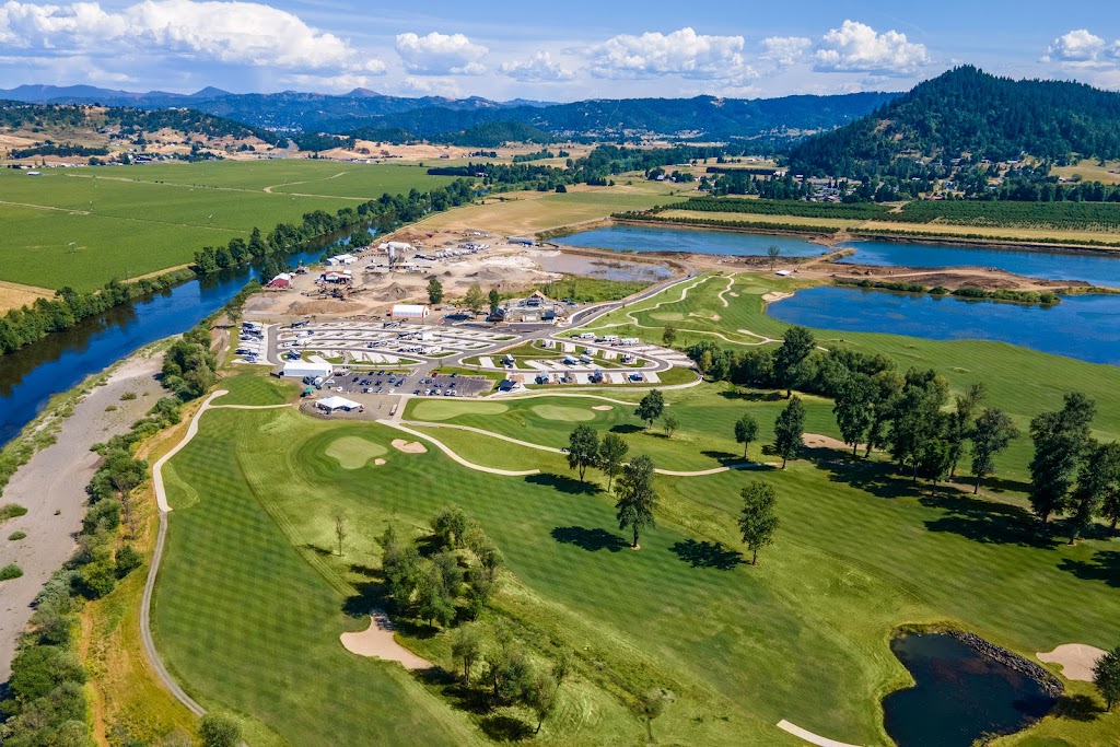 Panoramic view of a lush green golf course at Bar Run Golf & RV Resort. Smooth