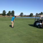 green grass with the flag in the hole.