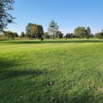 Panoramic view of a lush green golf course at Battle Ground Golf Club LLC. Smooth