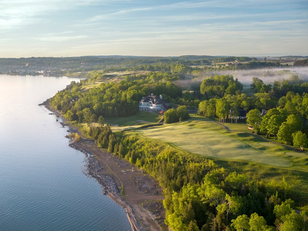 Panoramic view of a lush green golf course at Bay Harbor Golf Club. Smooth