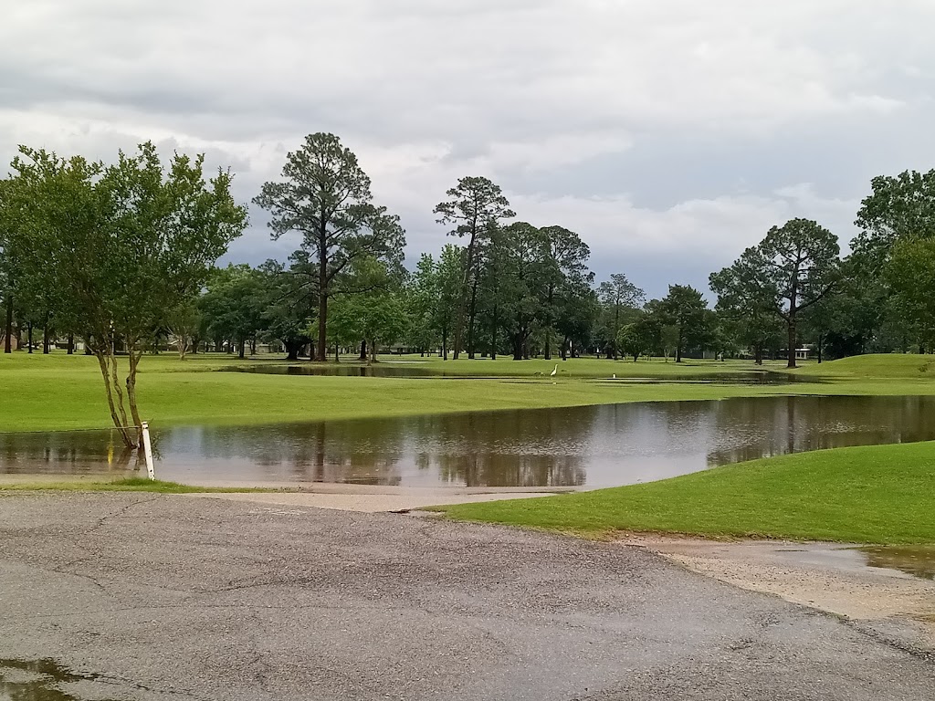 Panoramic view of a lush green golf course at Bayou Bend Golf &Health Club. Smooth