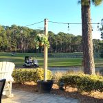 Panoramic view of a lush green golf course at Bear Creek Golf Club. Smooth