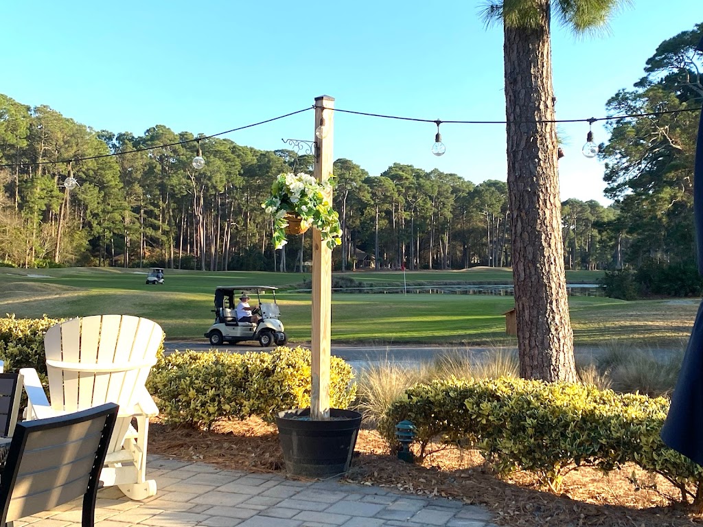 Panoramic view of a lush green golf course at Bear Creek Golf Club. Smooth