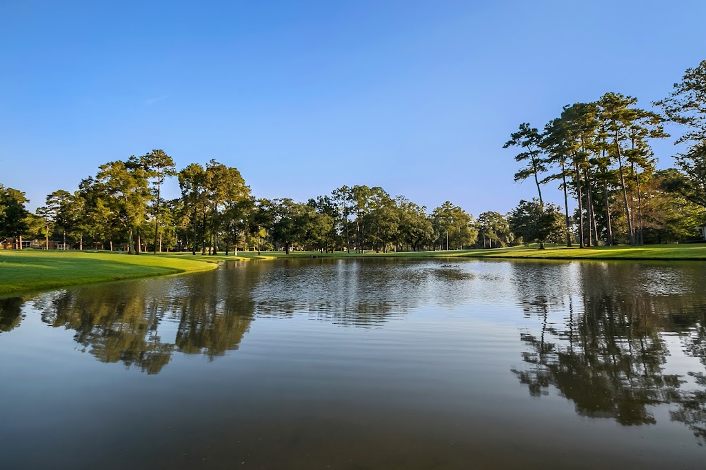 Panoramic view of a lush green golf course at Beau Chene Country Club. Smooth