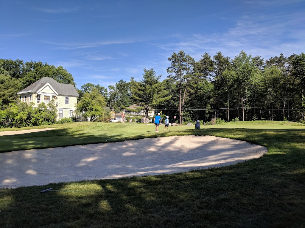 Panoramic view of a lush green golf course at Beaver Meadow Golf Course. Smooth