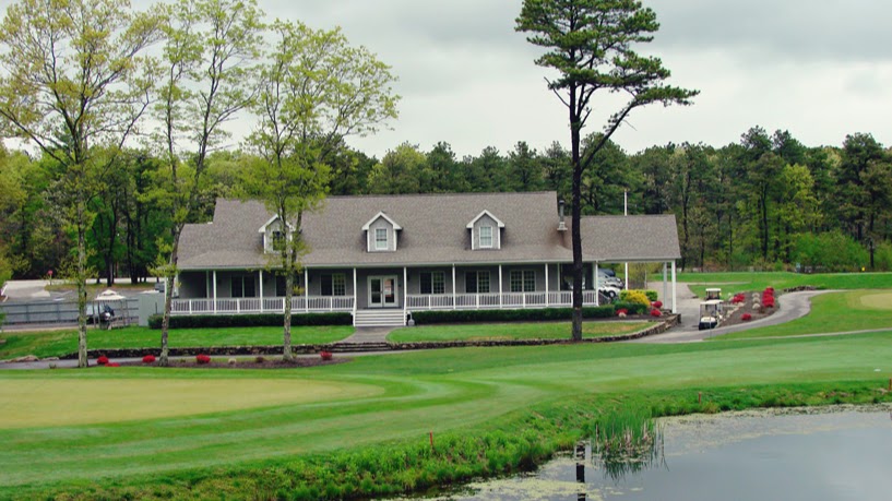 Panoramic view of a lush green golf course at Beaver River Golf Club. Smooth