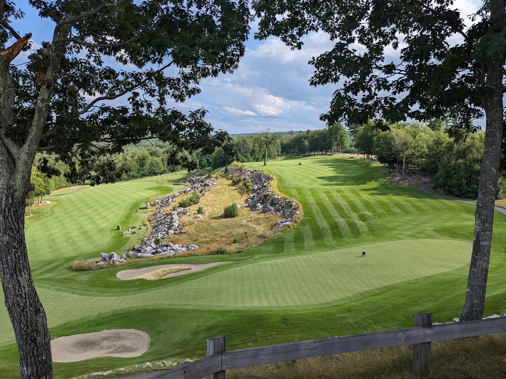 Panoramic view of a lush green golf course at Belgrade Lakes Golf Club. Smooth