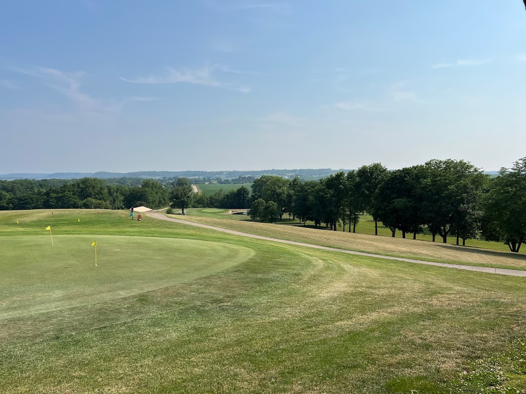 Panoramic view of a lush green golf course at Bellevue Golf Club. Smooth