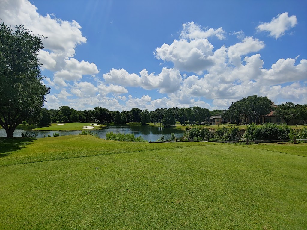 Panoramic view of a lush green golf course at Bent Tree Country Club. Smooth