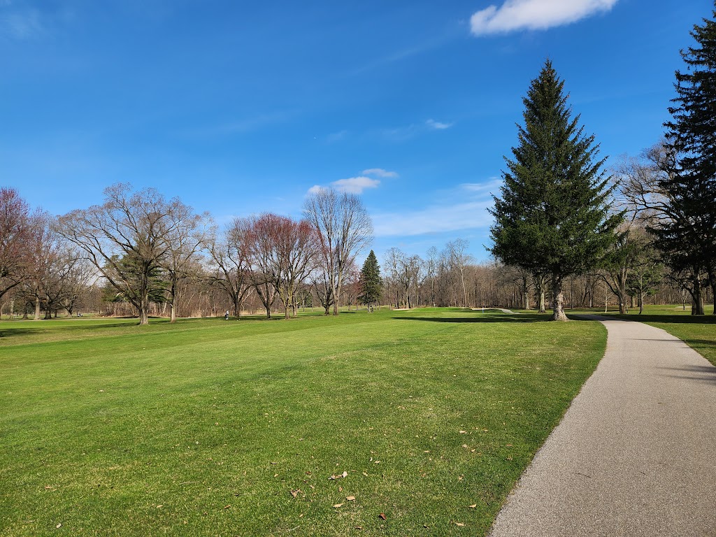 Panoramic view of a lush green golf course at Big Met Golf Course. Smooth