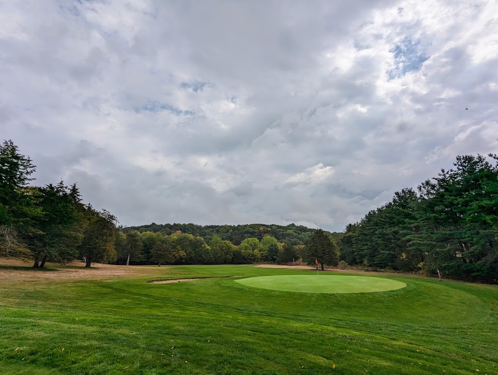 Panoramic view of a lush green golf course at Big Rock Country Club. Smooth