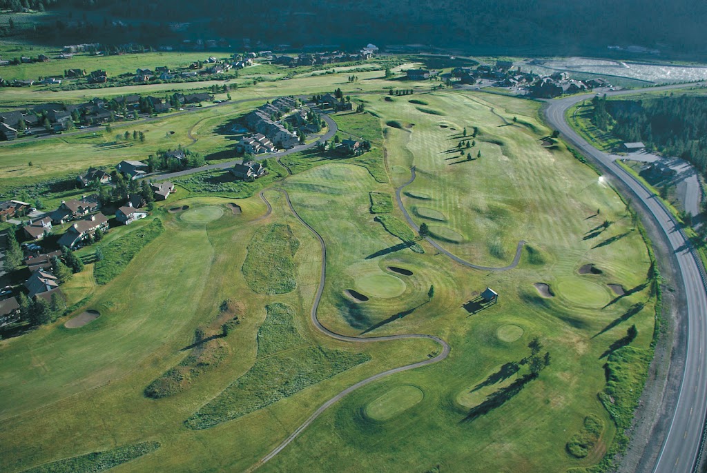 Panoramic view of a lush green golf course at Big Sky Golf Course & Nordic Center. Smooth