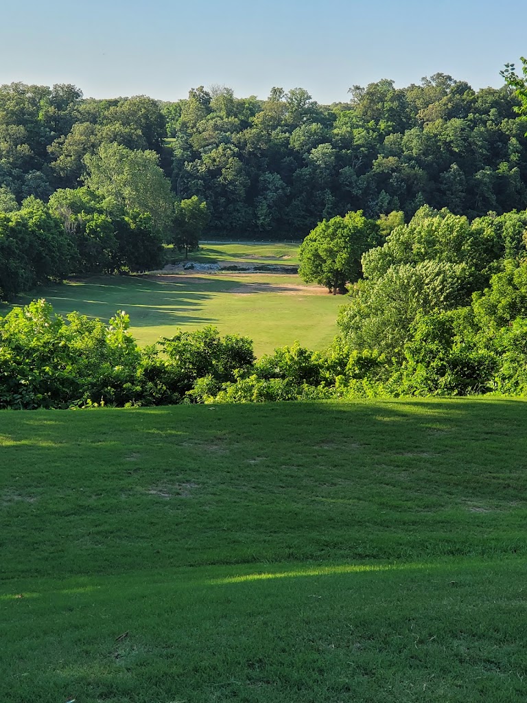 Panoramic view of a lush green golf course at Big Sugar Golf Club. Smooth