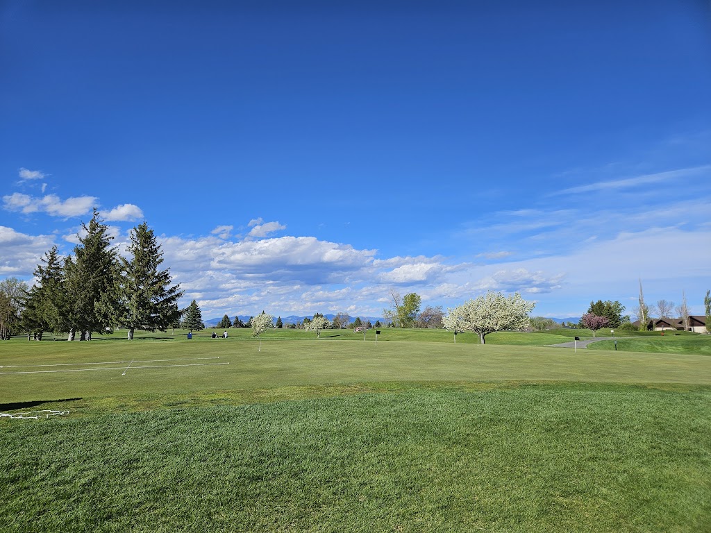 Panoramic view of a lush green golf course at Bill Roberts Golf Course. Smooth