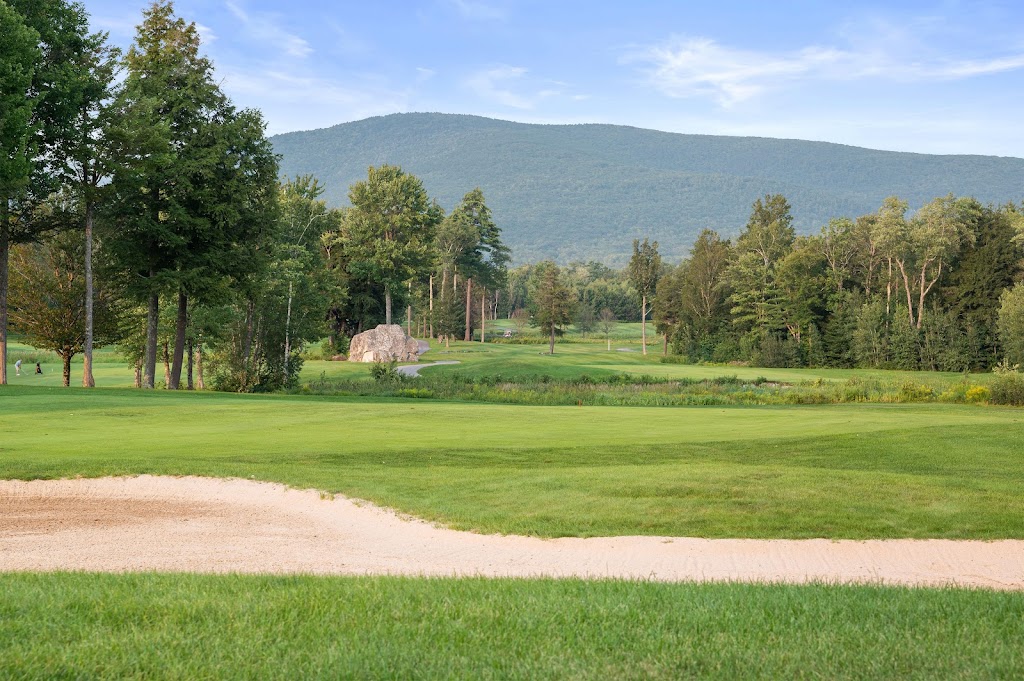 Panoramic view of a lush green golf course at Birch Hill Country Club. Smooth