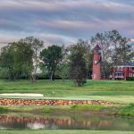 Panoramic view of a lush green golf course at Birdwood Golf Course. Smooth