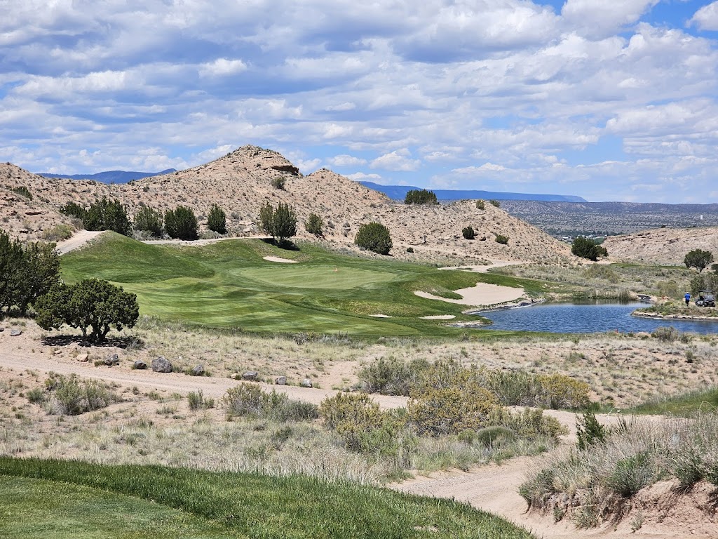 Panoramic view of a lush green golf course at Black Mesa Golf Club. Smooth