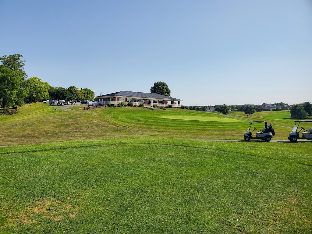 Panoramic view of a lush green golf course at Black Rock Golf Course. Smooth