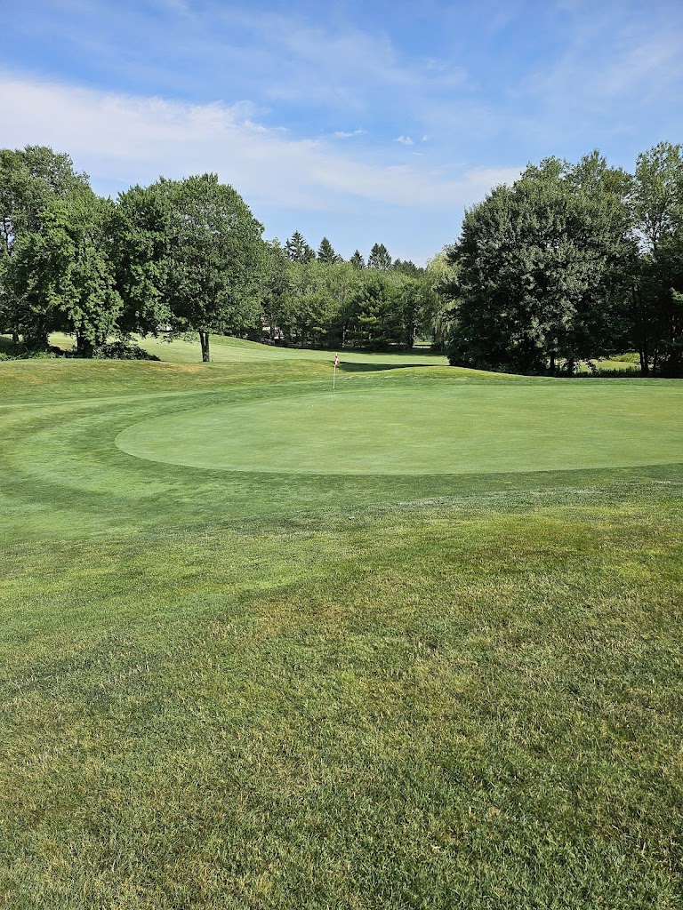 Panoramic view of a lush green golf course at Blackledge Country Club. Smooth