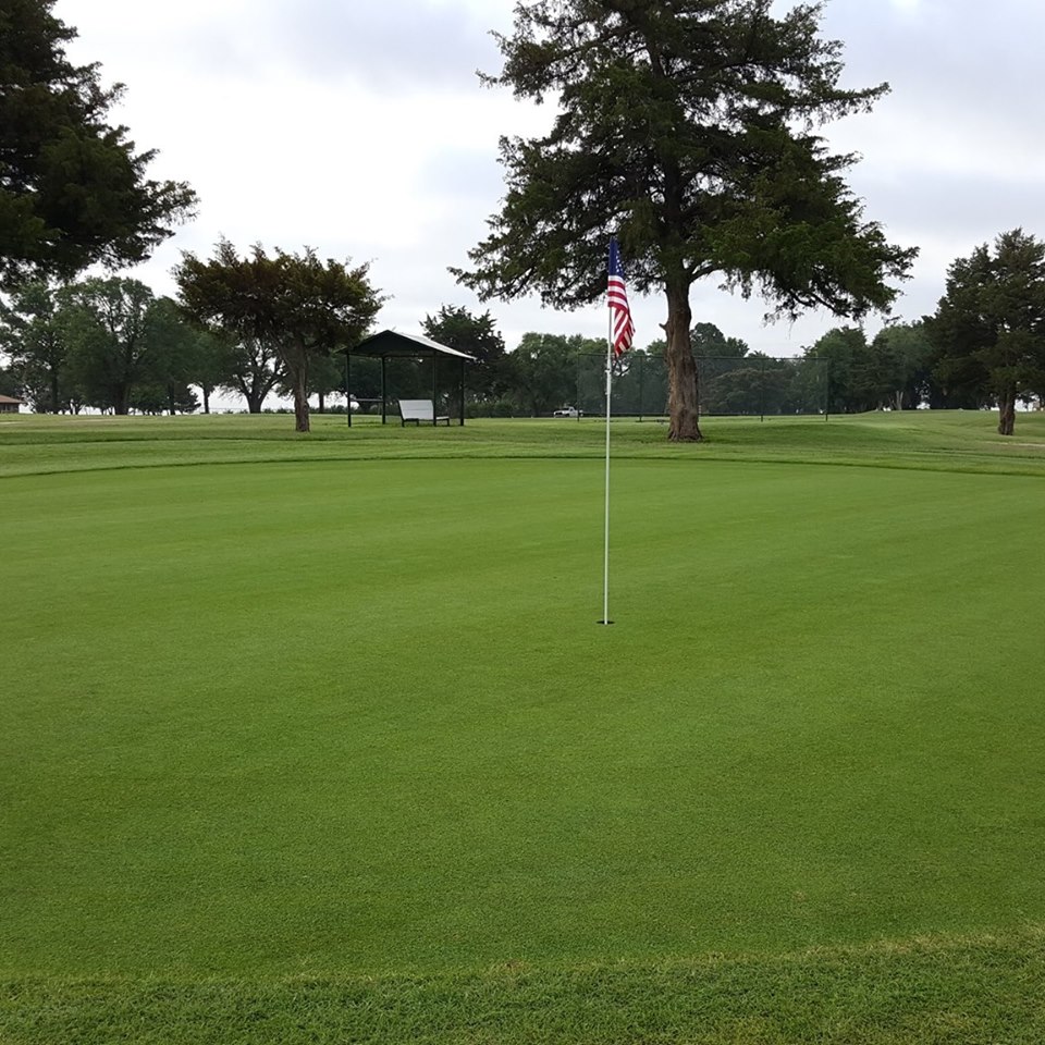 Panoramic view of a lush green golf course at Blackwell Municipal Golf Course. Smooth