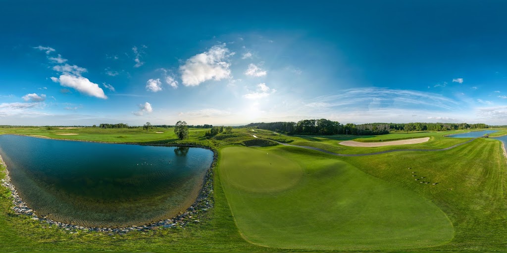 Panoramic view of a lush green golf course at Blackwolf Run Golf Course. Smooth