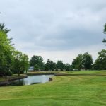 Panoramic view of a lush green golf course at Blue Ash Golf Course. Smooth