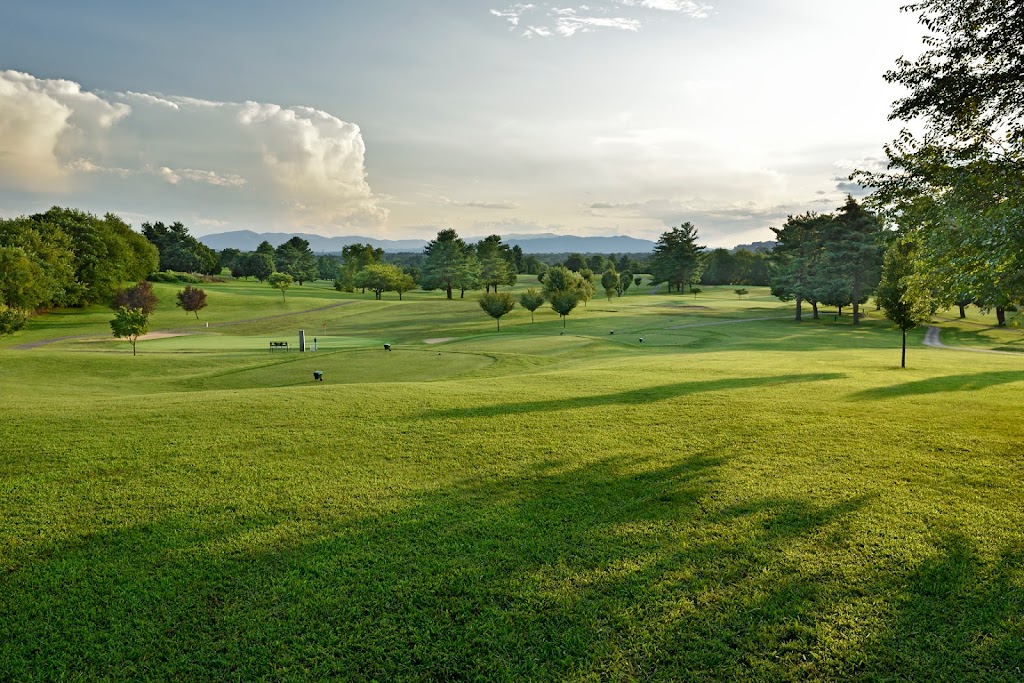 Panoramic view of a lush green golf course at Blue Hills Golf Club. Smooth