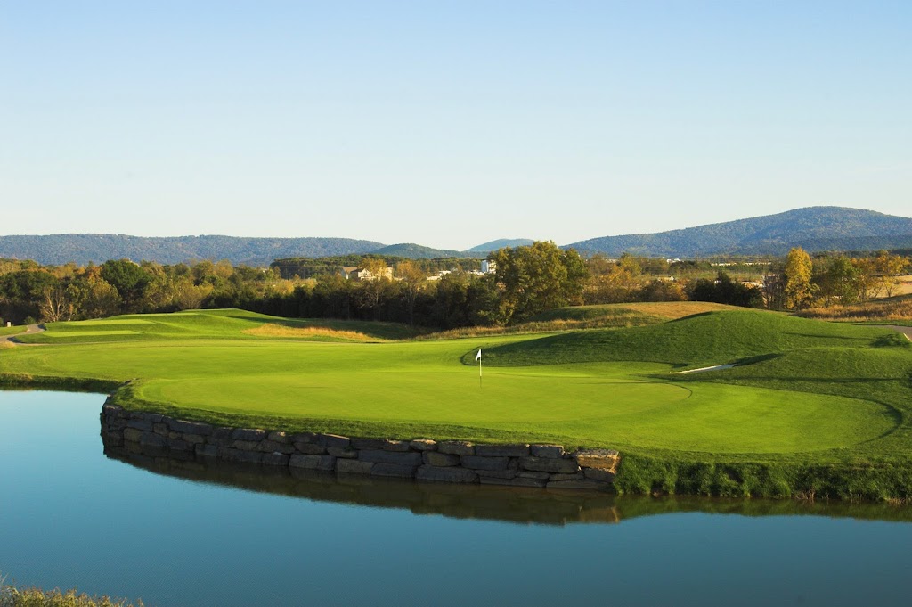 Panoramic view of a lush green golf course at Blue Ridge Shadows Golf Club. Smooth