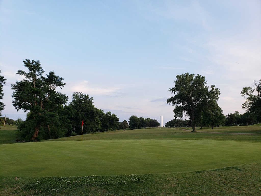 Panoramic view of a lush green golf course at Brent Bruehl Memorial Golf Course. Smooth