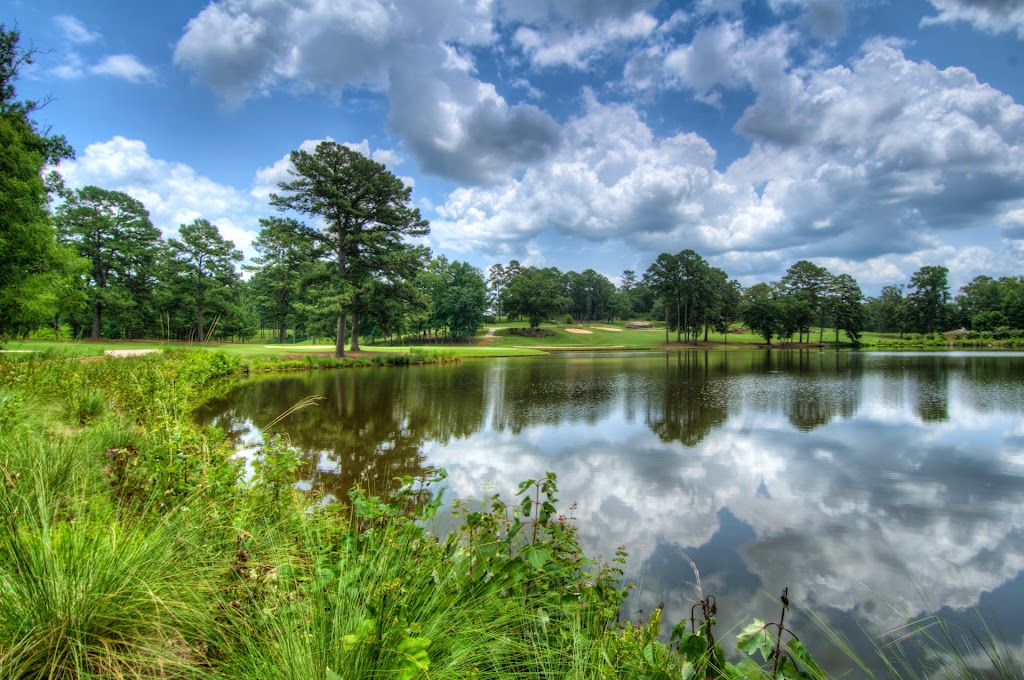 Panoramic view of a lush green golf course at Brickyard Golf Club. Smooth