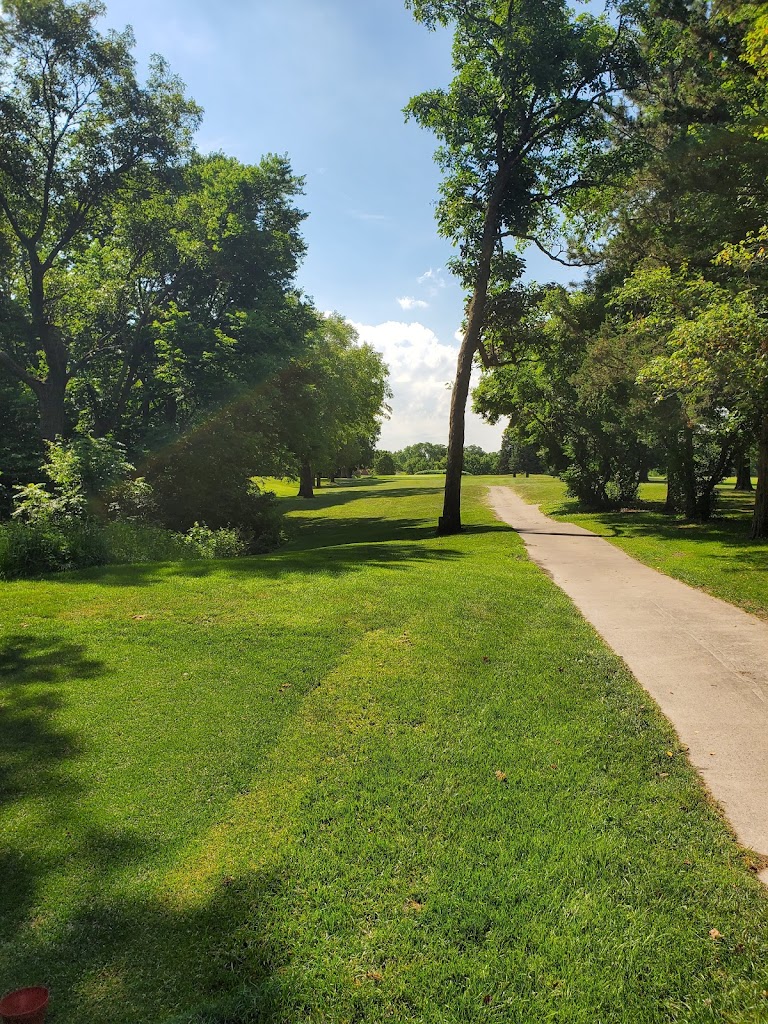 Panoramic view of a lush green golf course at Briggs Woods Golf Course. Smooth