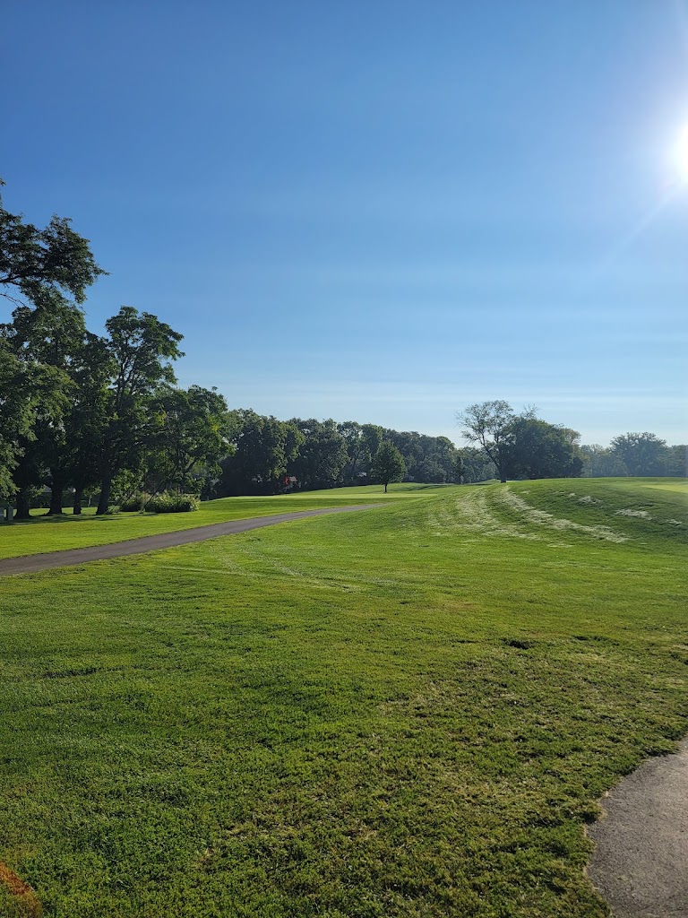 Panoramic view of a lush green golf course at Bright Grandview Golf Course. Smooth