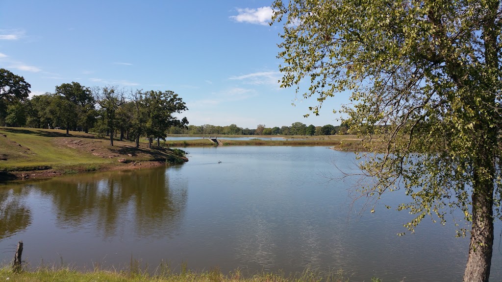 Panoramic view of a lush green golf course at Bristow Golf & Country Club. Smooth