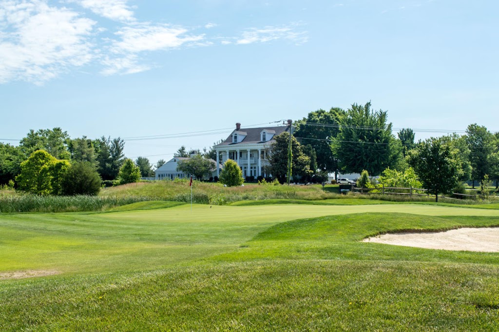 Panoramic view of a lush green golf course at Bristow Manor Golf Club. Smooth