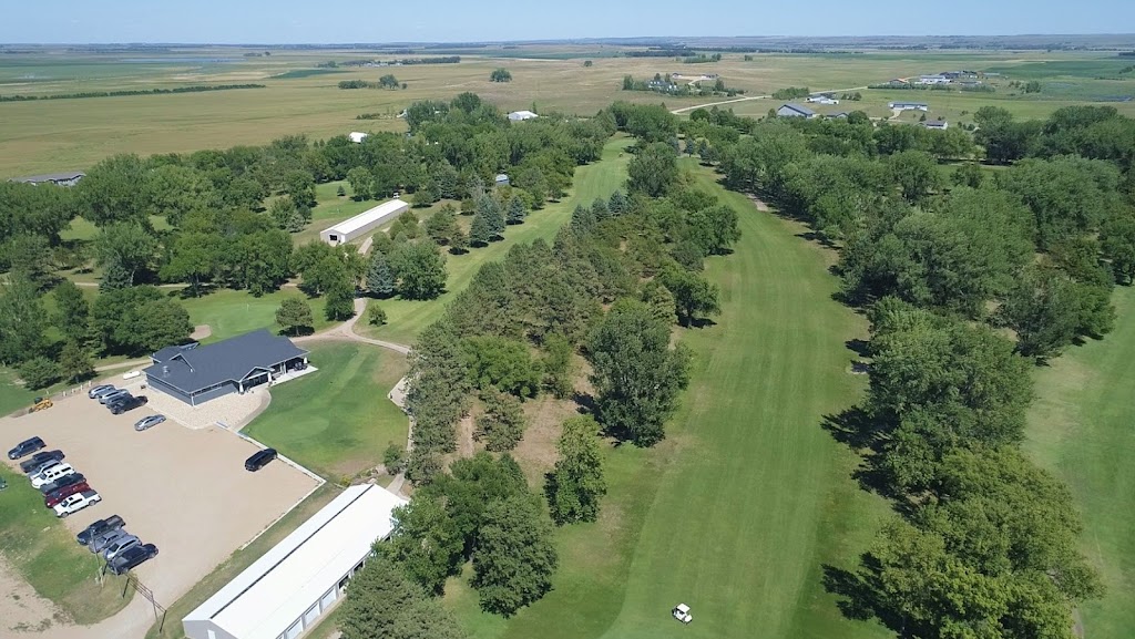 Panoramic view of a lush green golf course at Britton Country Club. Smooth