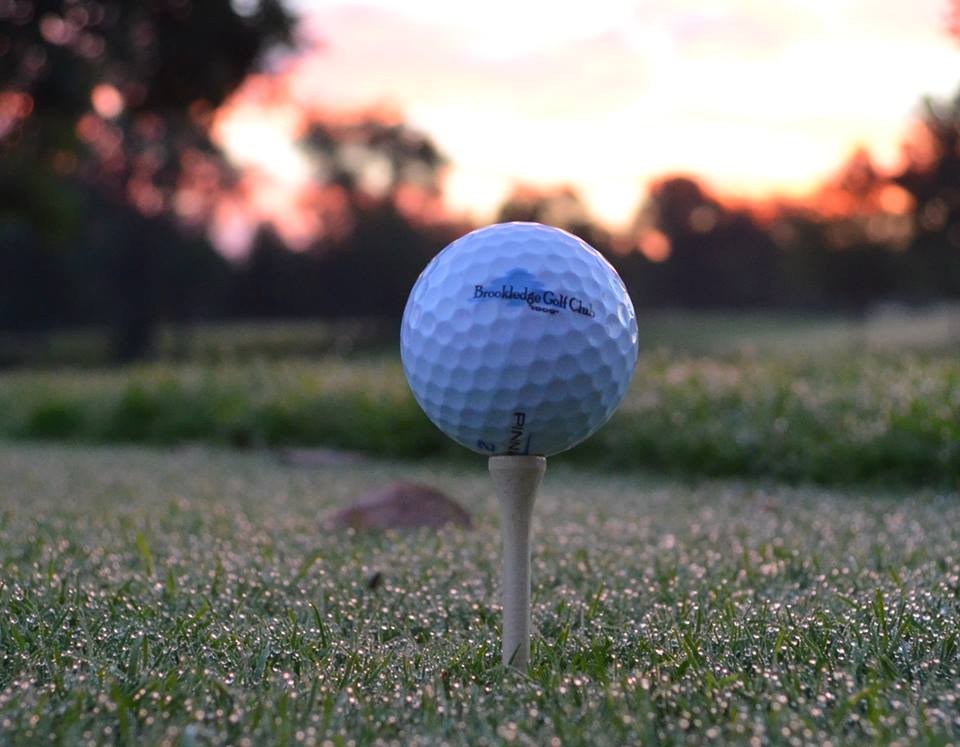 Panoramic view of a lush green golf course at Brookledge Golf Club. Smooth